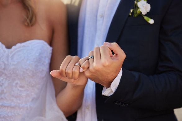 a bride and groom holding hands